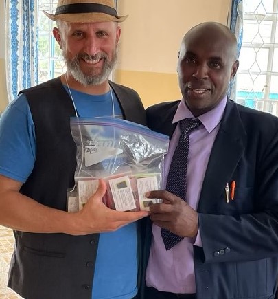 Handing off the SeedPlayers to a Kenyan pastor Samuel.